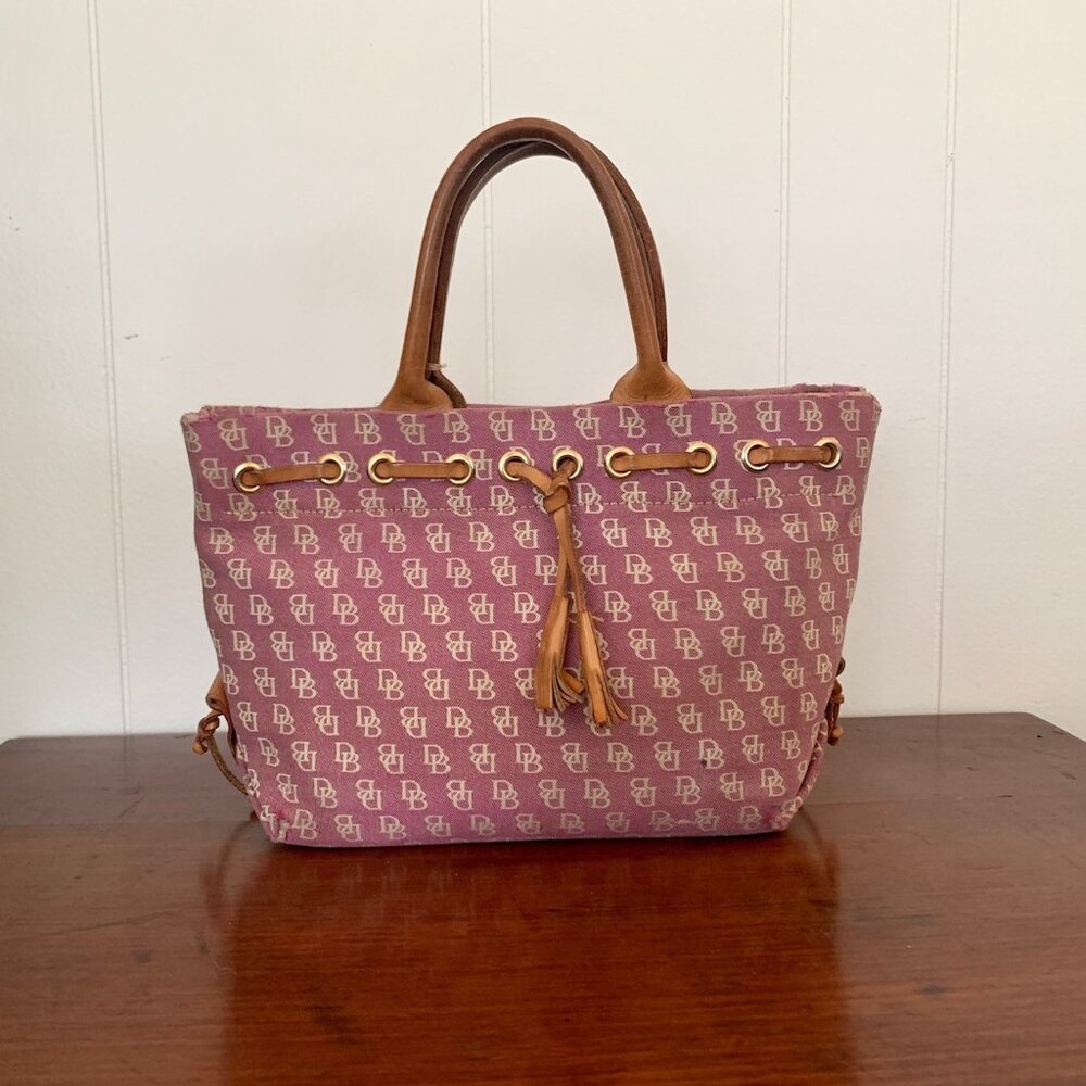 Dooney & Bourke small hand bag with leather handles and trim